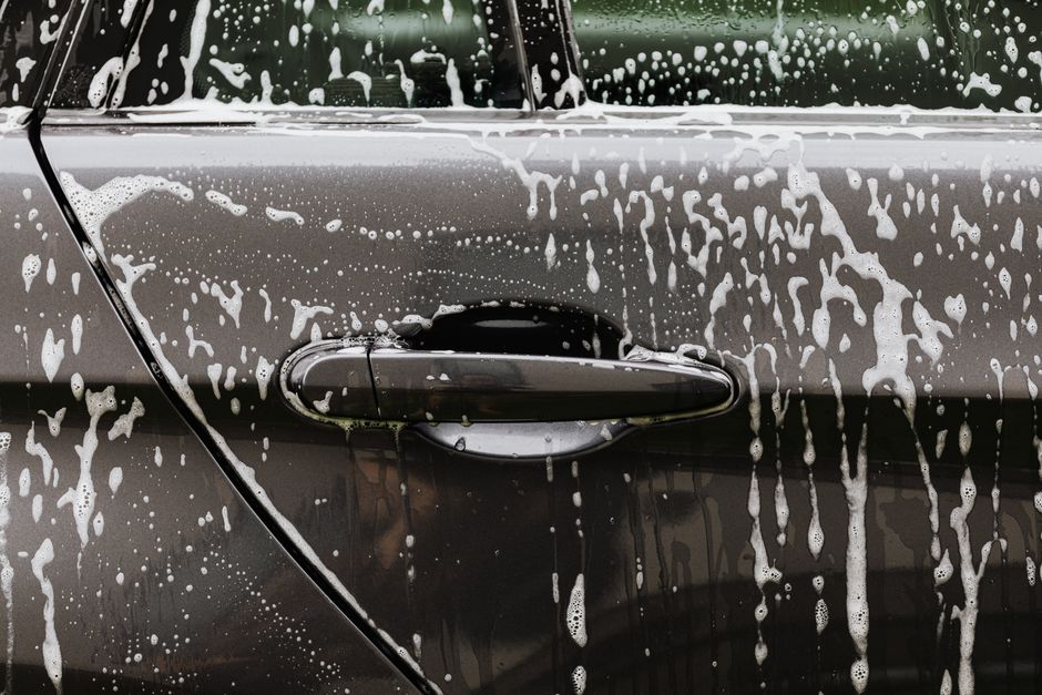 Thick car wash foam applied to a vehicle